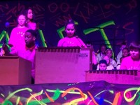 student about to use xylophone on stage