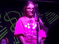 a student singing on stage